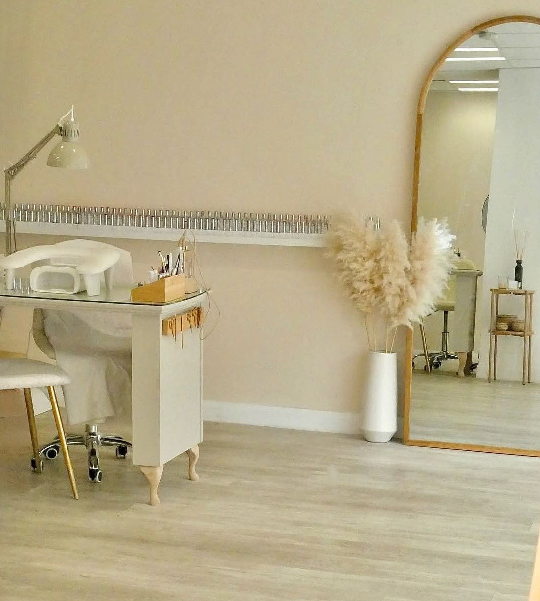 Salon interior with mirrors, chairs, and a counter.